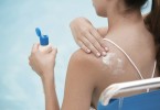 Woman Applying Sunscreen